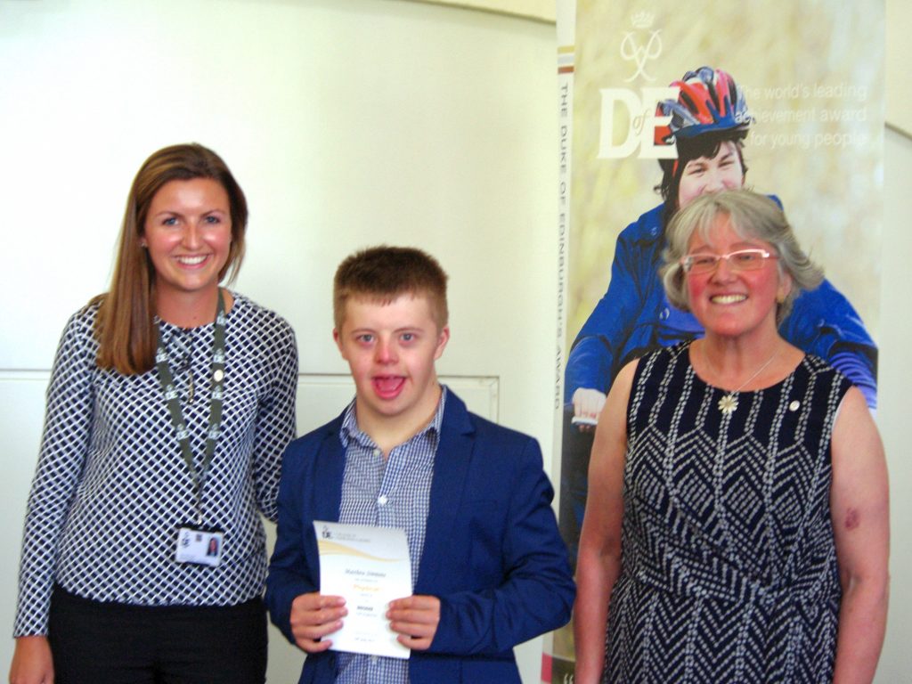 Matthew Simmons, 15, receiving his certificate from Alice McLinden and ...